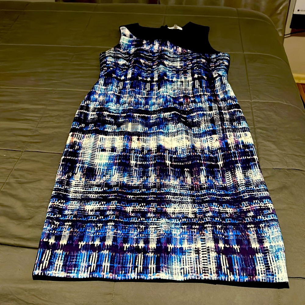 DKNY New with out tag, has a beautiful open detail on front